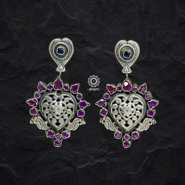 Complete your wardrobe with the elegance of these Double Sided Silver Earrings. Featuring maroon and deep blue stones, crafted in silver, they can easily be switched up to match any outfit. Perfect for any occasion.