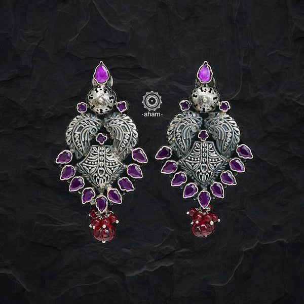 Beautiful Summer Love earrings. Handcrafted in silver with maroon coloured stone highlights. 