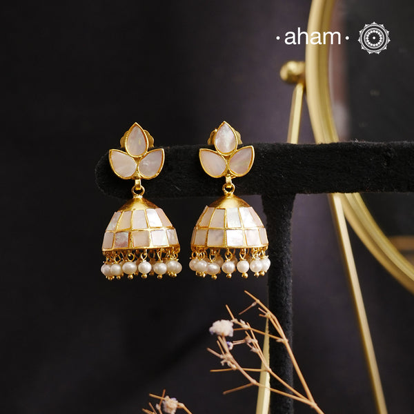 Embrace the allure of timeless elegance with Aham Jewellery’s latest Mother of Pearl collection, a radiant choice for festive celebrations and weddings.
The Jhumkie is crafted in 92.5 silver and adorned with a luxurious gold polish, capturing the iridescent beauty of mother of pearl.
This collection is designed with festivities, bridesmaids, and destination weddings in mind, offering a versatile blend of tradition and contemporary charm. Ideal for those seeking an ethereal statement, our Mother of Pearl