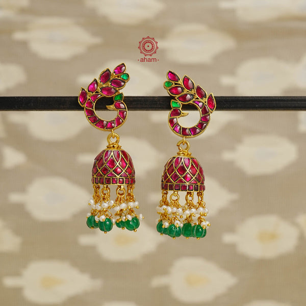 Introducing these Peacock Gold Polish Silver Jhumkie earrings - stunningly designed with a temple style inspired by ancient craftsmanship. Finely crafted with 92.5 sterling silver and a beautiful gold polish, they boast exquisite details that make them truly unique. The pearls add a gentle touch to the intricate design, making these earrings so light yet gorgeous. 