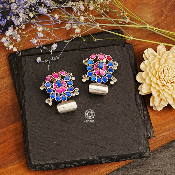 Ira drop earrings with elegant Blue and pink kundan. Handcrafted in 92.5 sterling silver with semi precious stone setting. Can be paired with both ethnic and western outfits. 
