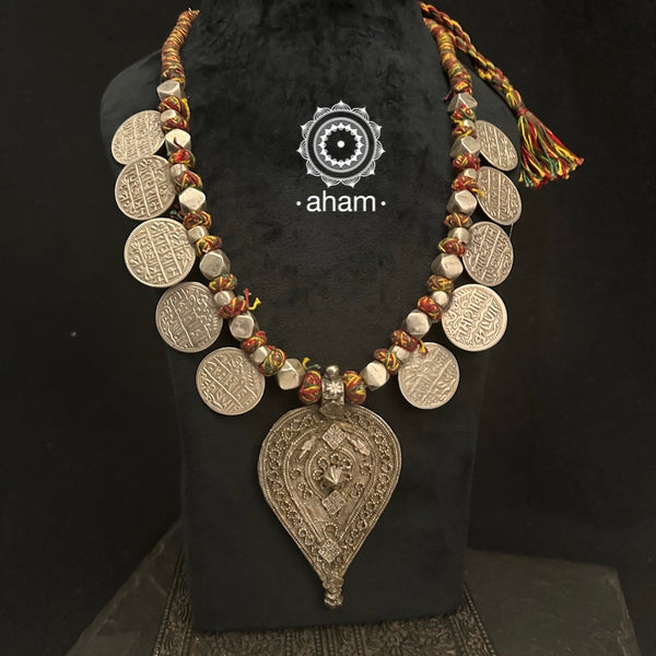 Tribal silver neckpiece handcrafted by threading together multiple tribal . This necklace truly exemplifies the continuity of the traditional prototypes.
