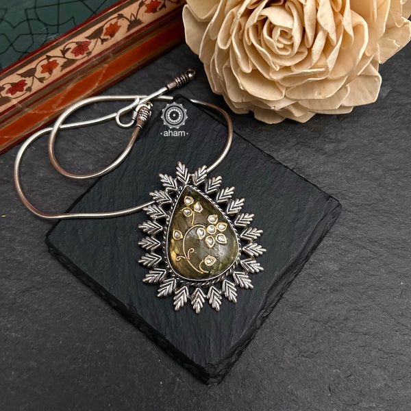 Handmade stone pendant with Mughal Inspired intricate floral inlay work in semi precious stone setting, encased in silver. Wear it long or short with a chain of your choice, or a smart silver Hasli. A piece so timeless that it can we worn across generations.  (Does not include chain)