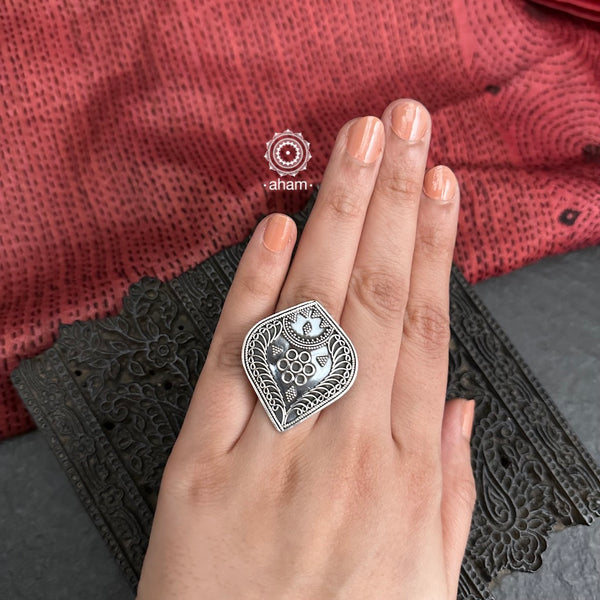 This classic Rava Silver Ring is crafted from 92.5 sterling silver with a unique fine rava work. Adjustable to fit any finger size, it's the perfect accessory to add a touch of elegance to any look.