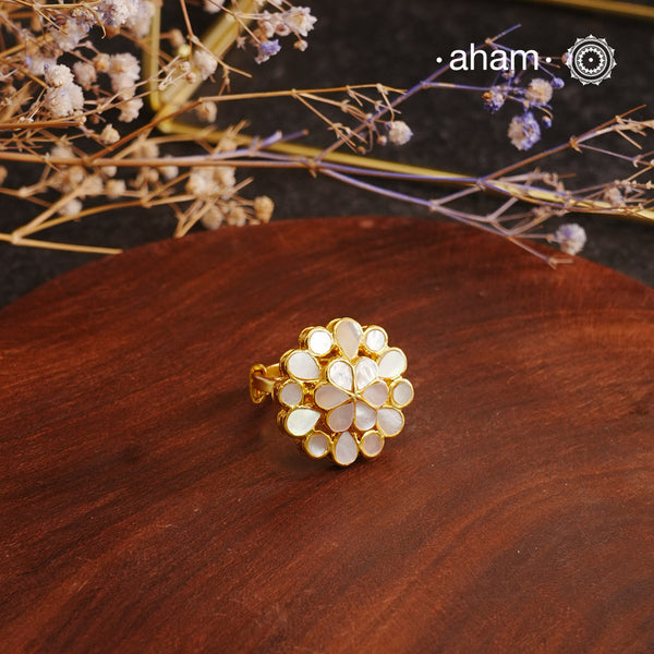 Embrace the allure of timeless elegance with Aham Jewellery’s latest Mother of Pearl collection, a radiant choice for festive celebrations and weddings.The ring is crafted in 92.5 silver and adorned with a luxurious gold polish, capturing the iridescent beauty of mother of pearl.This collection is designed with festivities, bridesmaids, and destination weddings in mind, offering a versatile blend of tradition and contemporary charm. Ideal for those seeking an ethereal statement, our Mother of Pearl collecti