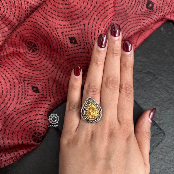 Enhance your style with the timeless elegance of the Noori Two Tone Silver Ring. Handcrafted by skilled karigars in Barmer, Rajasthan, this kada features traditional Bandhel work, where a thin sheet of 22 carat hand beaten gold is set on
