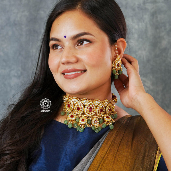 Make a sophisticated style statement this festive season with our beautiful gold polish neckpiece and earrings set. Crafted using traditional jadau kundan techniques in silver with semi precious beads and cultured pearls. Perfect for intimate weddings and upcoming festive celebrations.