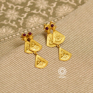 Classic gold polish earrings with intricate motifs of lord Ganesha. Handcrafted in 92.5 sterling silver with stones. Lightweight earrings perfect for festivities and special occasions. 