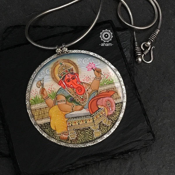 Hand painted silver Ganesha pendant. Intricate miniature painting work done by skilful artisans to create these beautiful wearable art pieces.  (Does not include chain)