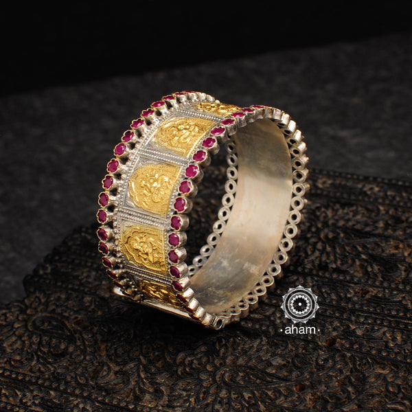 Two tone Ganesha silver kada with maroon kemp highlights. The price is for one piece kada only. 