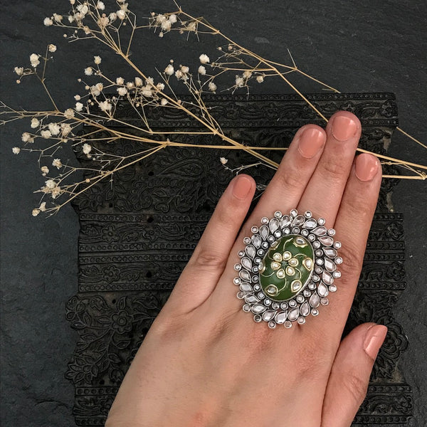 Ira adjustable ring, handcrafted intricately in 92.5 sterling silver with Kundan inlay work and zircon stone highlights.  Perfect for special occasions and festivities.