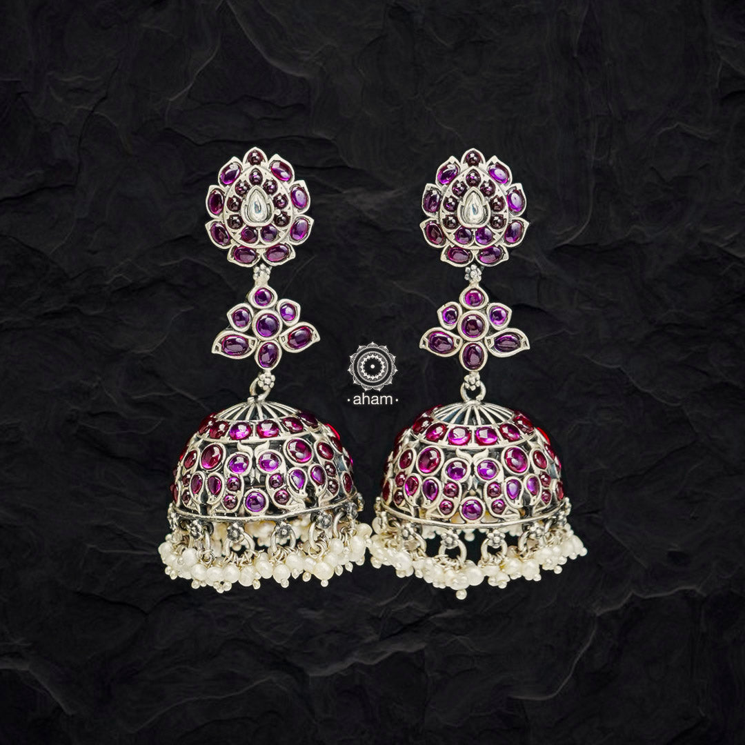 Handcrafted pair of Nrityam jhumkie earrings in 92.5 sterling silver. With lotus motifs, kemp stone setting and hanging cultured pearls. Master craftsmanship, a piece that can be passed on to generations to come  