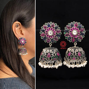 Handcrafted pair of Nrityam flower jhumkie earrings in 92.5 sterling silver. Comes with elephant motifs, blue, green and maroon kemp stone setting and dangling cultured pearls. 