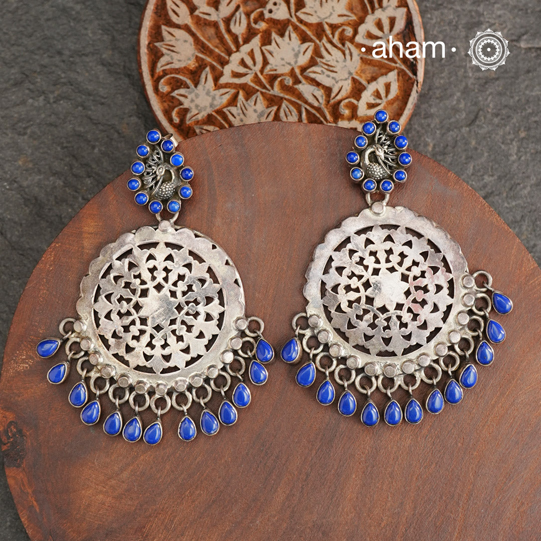 Beautiful handcrafted Lapiz Peacock earring with intricate cut work. These 92.5% Silver Peacock earrings looks elegant and beautiful with matching ethnic attire. Also, a great gifting option for jewellery admirers.