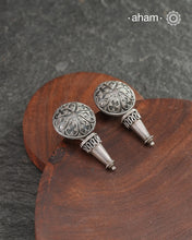 Mewad heart earrings with intricate floral work. Handcrafted in 92.5 sterling silver with dangling ghungroos. An ode to the glorious state of Rajasthan.