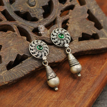 Mewad flower drop earrings with intricate floral work. Handcrafted in 92.5 sterling silver with dangling ghungroos. An ode to the glorious state of Rajasthan. 