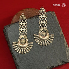Beautiful silver long earring handcrafted in 92.5 sterling silver with two little parrots. Light weight long statement pieces. Easy to wear all day long. An ode to the glorious state of Rajasthan.&nbsp;
