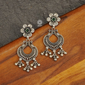 Mewad double peacock earrings handcrafted in 92.5 sterling silver with green and maroon stones. An ode to the glorious state of Rajasthan. Perfect pair of elegant danglers for your ethnic outfits