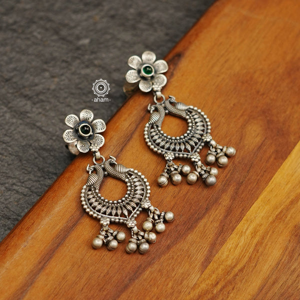 Mewad double peacock earrings handcrafted in 92.5 sterling silver with green and maroon stones. An ode to the glorious state of Rajasthan. Perfect pair of elegant danglers for your ethnic outfits