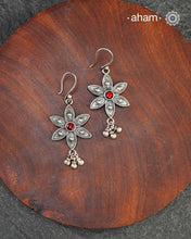 Expertly crafted with silver with a red ston center, our Mewad Flower Silver Earrings are the perfect accessory for everydaywear. Lightweight, fun and easy to wear all day long.