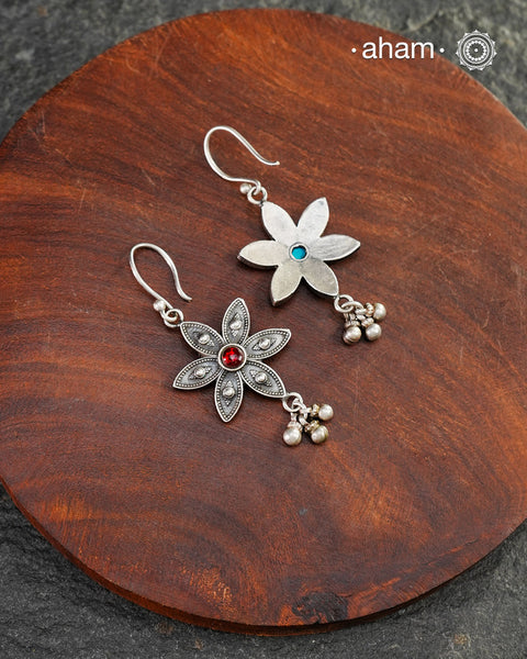 Expertly crafted with silver with a red ston center, our Mewad Flower Silver Earrings are the perfect accessory for everydaywear. Lightweight, fun and easy to wear all day long.