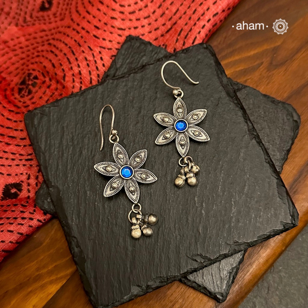 Expertly crafted with silver and adorned with a stunning blue stone, our Mewad Flower Silver Earrings are the perfect accessory for everydaywear. Lightweight, fun and easy to wear all day long.