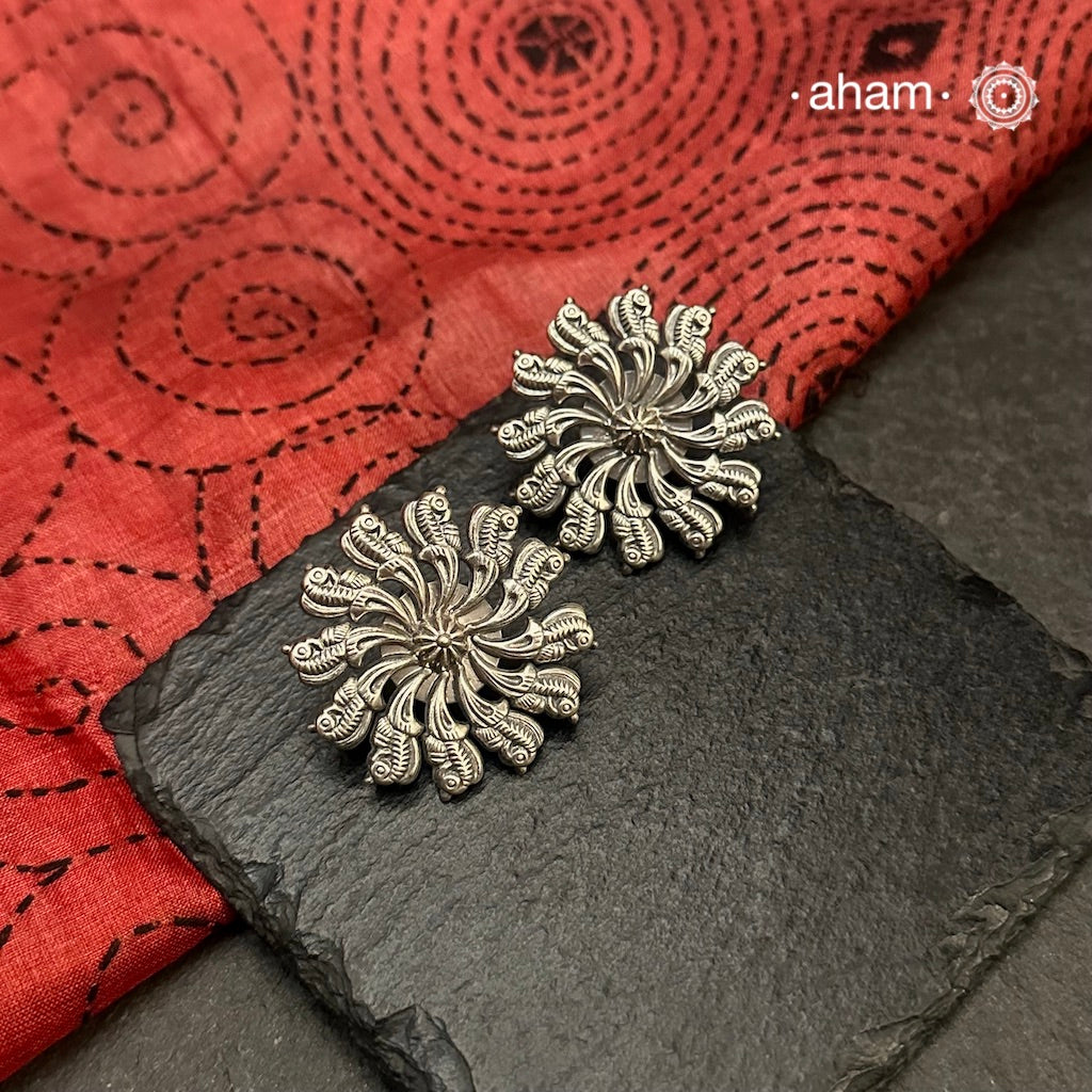 Mewad silver earrings handcrafted in 92.5 sterling silver with beautiful parrots.

An ode to the glorious state of  Rajasthan. Light weight, great as everyday and ethnic wear.