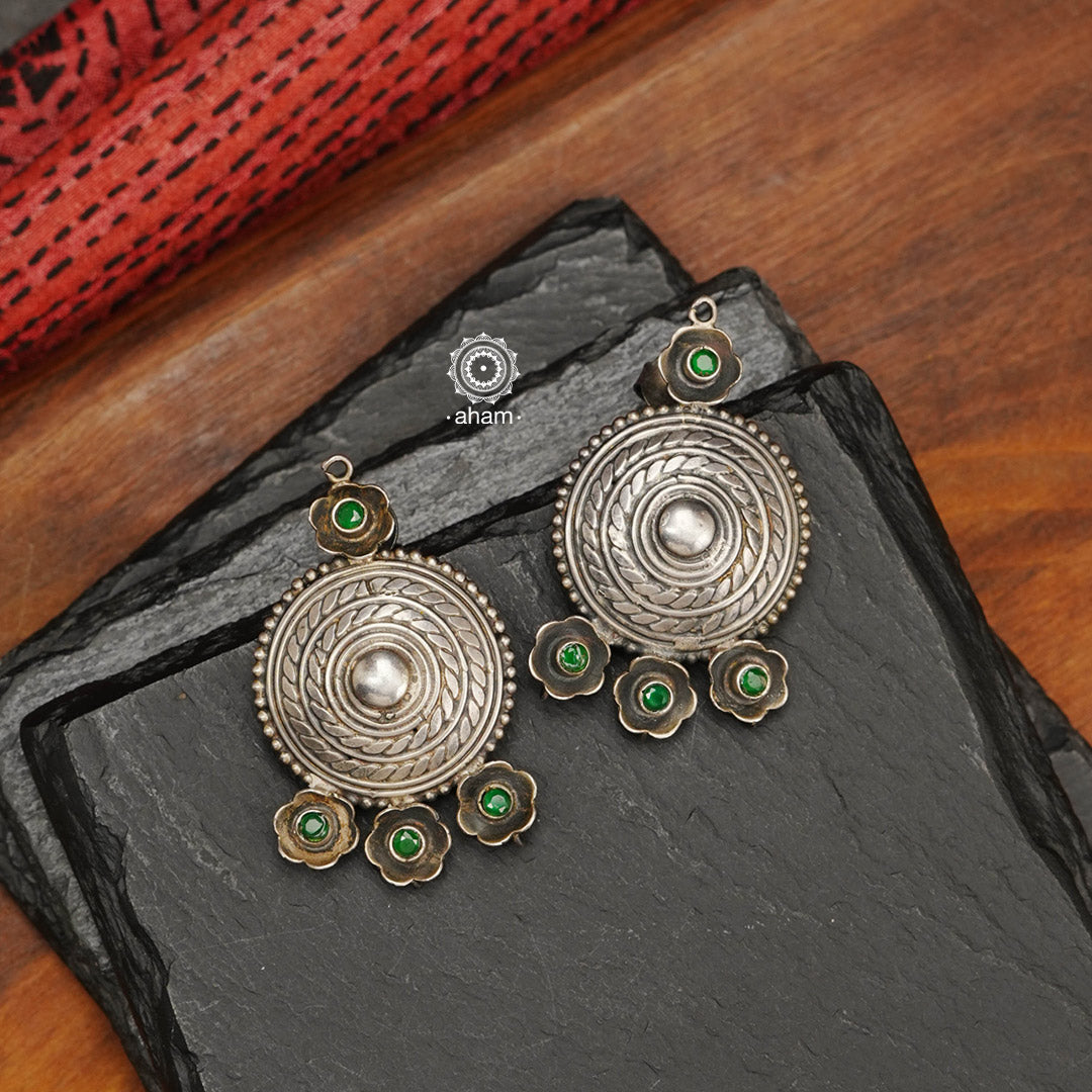 92.5 sterling silver handcrafted beauties with Green Stones.  These are lightweight and so easy to wear and pair with your party outfit. 