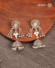 Light weight silver jhumkies crafted in 92.5 silver and laced with pearls. 