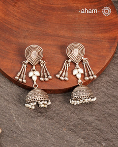 Light weight silver jhumkies crafted in 92.5 silver and laced with pearls. 