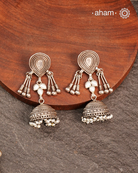 Light weight silver jhumkies crafted in 92.5 silver and laced with pearls. 