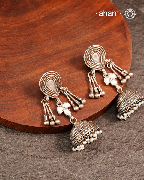 Light weight silver jhumkies crafted in 92.5 silver and laced with pearls. 