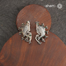 Discover the beauty of our Summer Love Fish Silver Earrings, handcrafted from 92.5 silver. Adorned with green stone, ghungroos and pearl highlights, these unique earrings will add a touch of elegance to any ensemble. Embrace your love for nature with this stunning accessory.