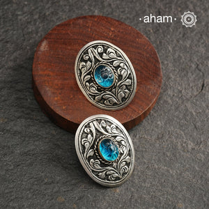 Everyday wear Summer Love silver earrings with beautiful chitai work and a vibrant blue stone in the center. Handcrafted in 92.5 sterling silver.