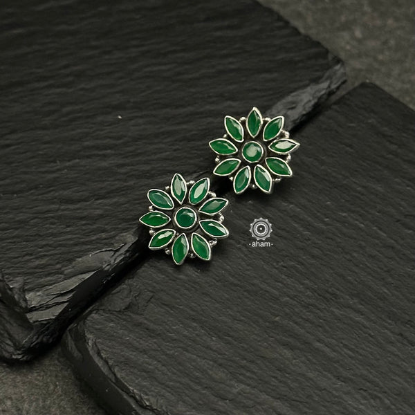 92.5 sterling silver studs with green stones. Light weight and easy to wear all day long.