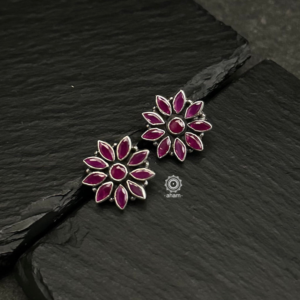 92.5 sterling silver studs with Maroon stones. Light weight and easy to wear all day long. 