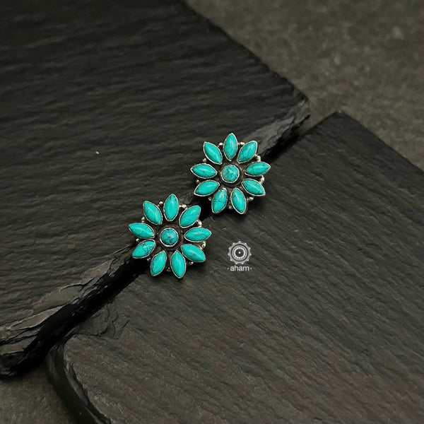 92.5 sterling silver studs with turquoise stones. Light weight and easy to wear all day long.