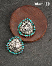 Summer love drop stud earrings with beautiful thapi work in the center and turquoise stone highlights. Handcrafted in 92.5 silver. Looks great with your everyday ethnic outfits.