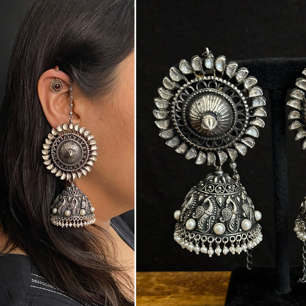 Statment jhumkie with kundan top and beautiful peacock Nakshi Jhumka base. Crafted in 92.5 silver.