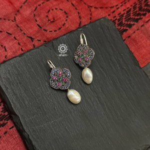 Make a sophisticated style statement with these delicate earrings crafted in 92.5 sterling silver with remarkable craftsmanship of stone setting finished off with a pearl drop. 