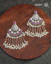 Make your special occasion even more special with these handcrafted 92.5 sterling silver danglers with intricate floral motifs and cultured pearls that will complete your look. Style this up with your favourite ethnic or fusion outfit