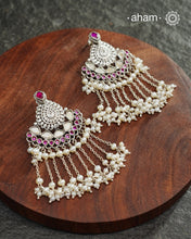 Make your special occasion even more special with these handcrafted 92.5 sterling silver danglers with intricate floral motifs and cultured pearls that will complete your look. Style this up with your favourite ethnic or fusion outfit