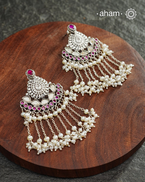 Make your special occasion even more special with these handcrafted 92.5 sterling silver danglers with intricate floral motifs and cultured pearls that will complete your look. Style this up with your favourite ethnic or fusion outfit