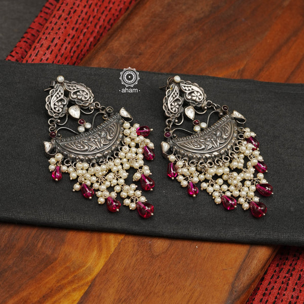 Handcrafted in 92.5 sterling silver with cultured pearls, double peacock motifs with spinels and kundan work. These festive earrings will add bling and drama to your jewellery collection.