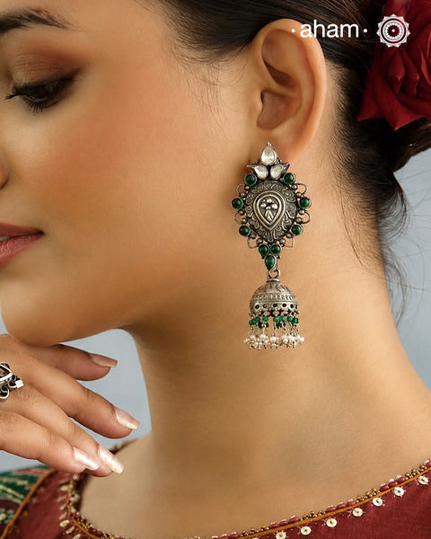 Beautiful light weight silver jhumkie crafted in 92.5 silver with green stone highlights.