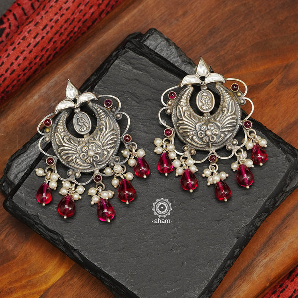 Handcrafted in 92.5 sterling silver with cultured pearls and kundan work. These festive earrings will add drama to your jewellery collection.