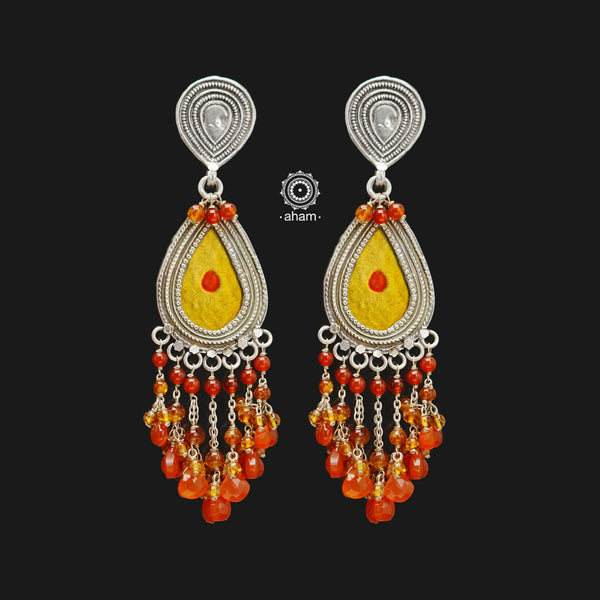 Indulge in the magic of traditional handcrafted Rang Mahal silver earrings. Made with 92.5 sterling silver and laced with semi precious stones, these yellow drop earrings are the perfect combination of elegance and color. Elevate your style and make a statement with these unique, expertly designed earrings.