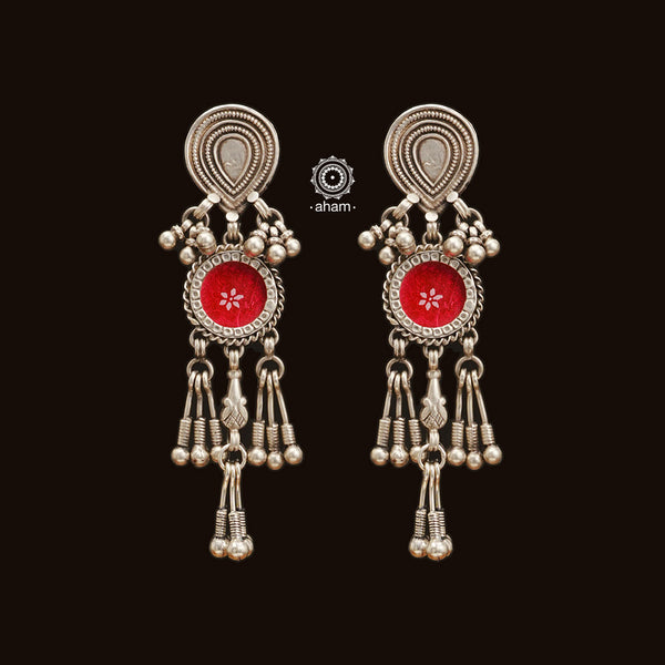 The Pink Rang Mahal Silver Earrings are handcrafted using 92.5 sterling silver and feature a stunning drop design. Experience the unique combination of glass, silver, and vibrant color that creates pure magic.