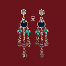 Expertly crafted from 92.5 sterling silver, these Rang Mahal earrings feature a stunning blue glass drop and vibrant turquoise and pink stone accents. The combination of glass, silver, and color creates a magical, eye-catching effect.