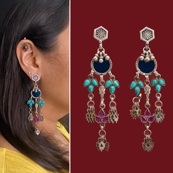 Expertly crafted from 92.5 sterling silver, these Rang Mahal earrings feature a stunning blue glass drop and vibrant turquoise and pink stone accents. The combination of glass, silver, and color creates a magical, eye-catching effect.